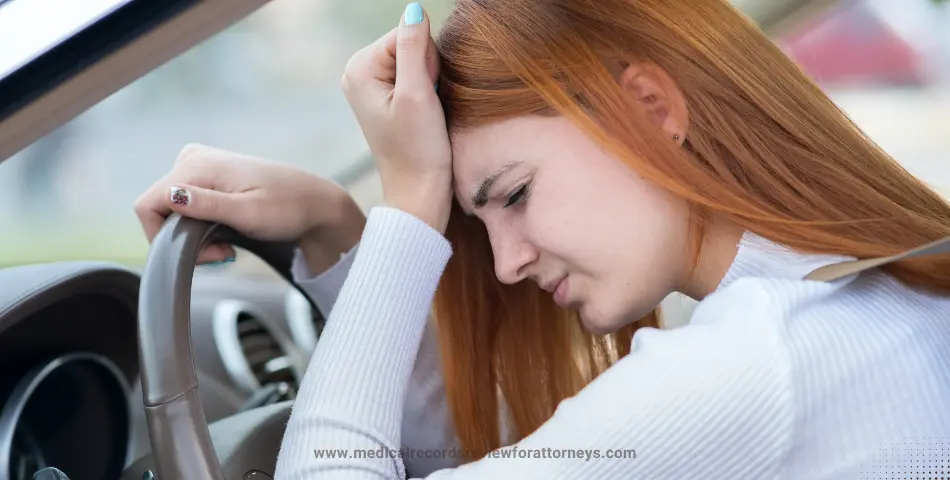 Distressed woman gripping steering wheel depicting Fear of Driving After an Accident