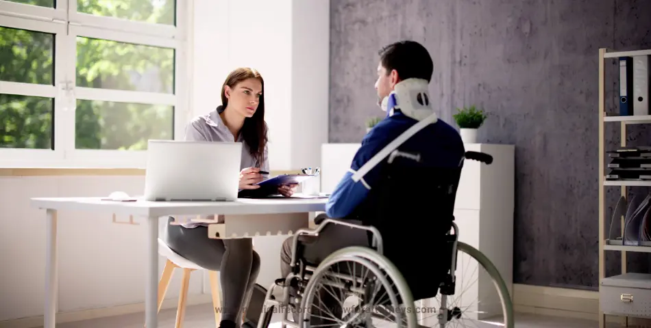 Attorney consulting a wheelchair-bound injury victim with neck brace and arm sling, representing injury witnesses in personal injury cases