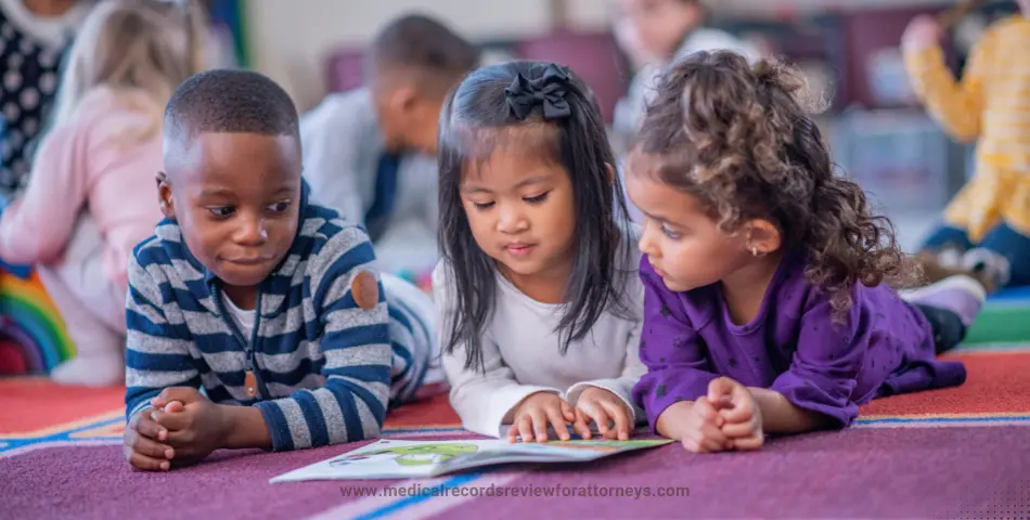 | Three young children reading a book together on a daycare floor, representing daycare negligence and child safety concerns in care facilities