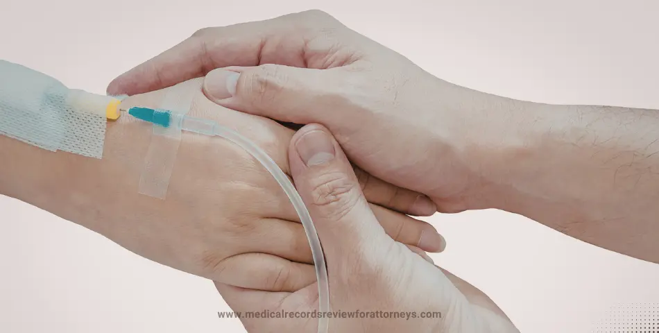 Close-up of hand holding patient’s hand with IV line during treatment, illustrating negligence in iron infusion