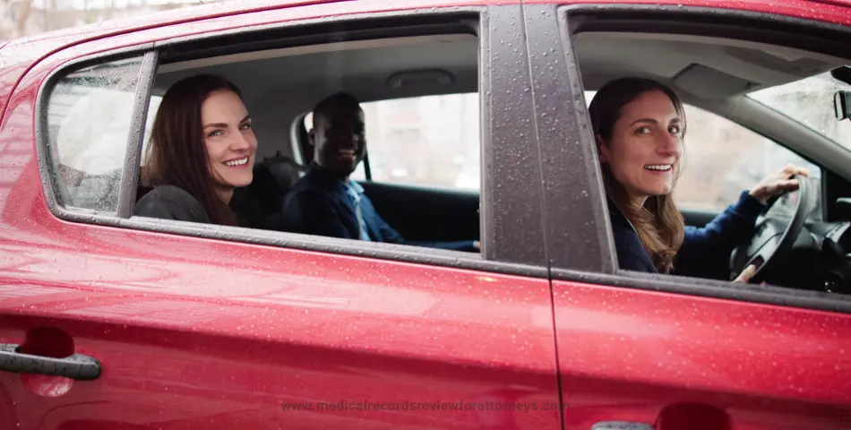 Female driver with two passengers in a red car, representing ride-sharing accidents and liability claims in personal injury cases
