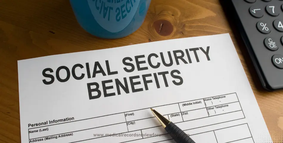 Close-up of Social Security benefits form with pen and calculator on wooden desk, illustrating Spousal Benefits