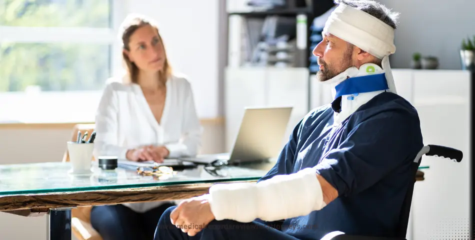Injured man in wheelchair with bandage and neck brace consulting at desk representing personal injury settlement