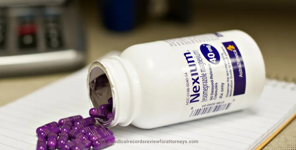 Nexium 40 mg capsules spilled from bottle on notebook representing Nexium lawsuit