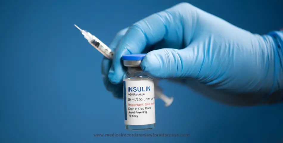 Medical professional holding insulin vial and syringe for injection, illustrating insulin overdose risk.